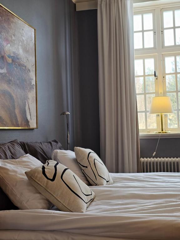 Postel nebo postele na pokoji v ubytování Furunäset Hotell & Konferens