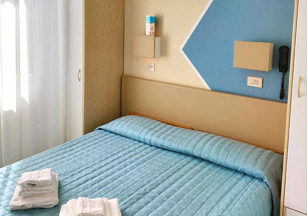 Postel nebo postele na pokoji v ubytování Hotel Cà Vanni