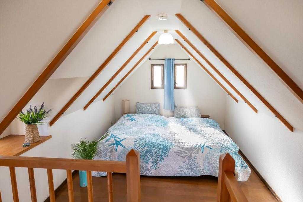 Postel nebo postele na pokoji v ubytování さくらvilla