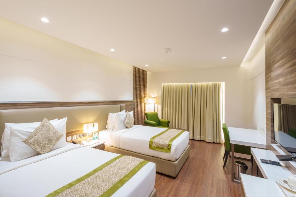 Postel nebo postele na pokoji v ubytování Pharos Hotels