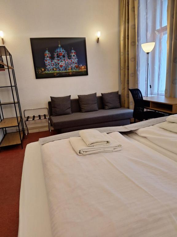 Postel nebo postele na pokoji v ubytování Hotel Amelie Berlin