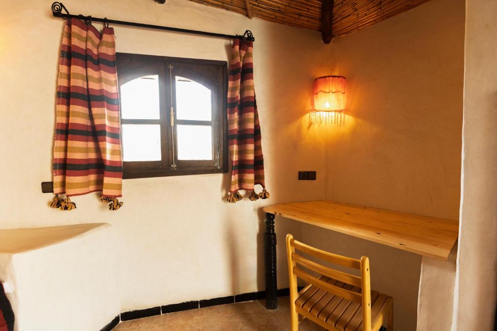 Postel nebo postele na pokoji v ubytování Ksar Sania - Merzouga