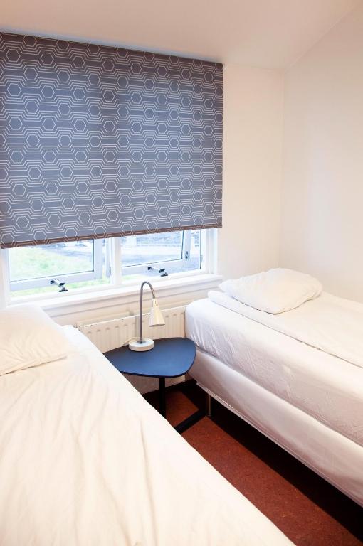 Postel nebo postele na pokoji v ubytování Lava Hostel