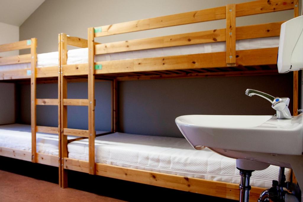 Postel nebo postele na pokoji v ubytování Lava Hostel