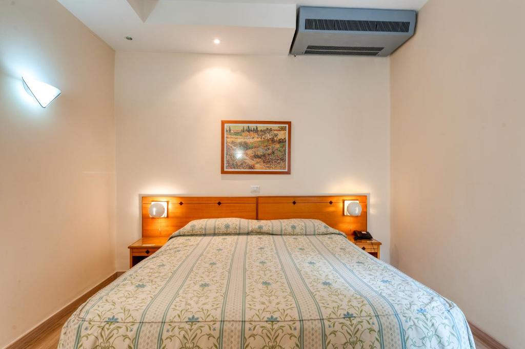 Postel nebo postele na pokoji v ubytování Hotel Barsotti