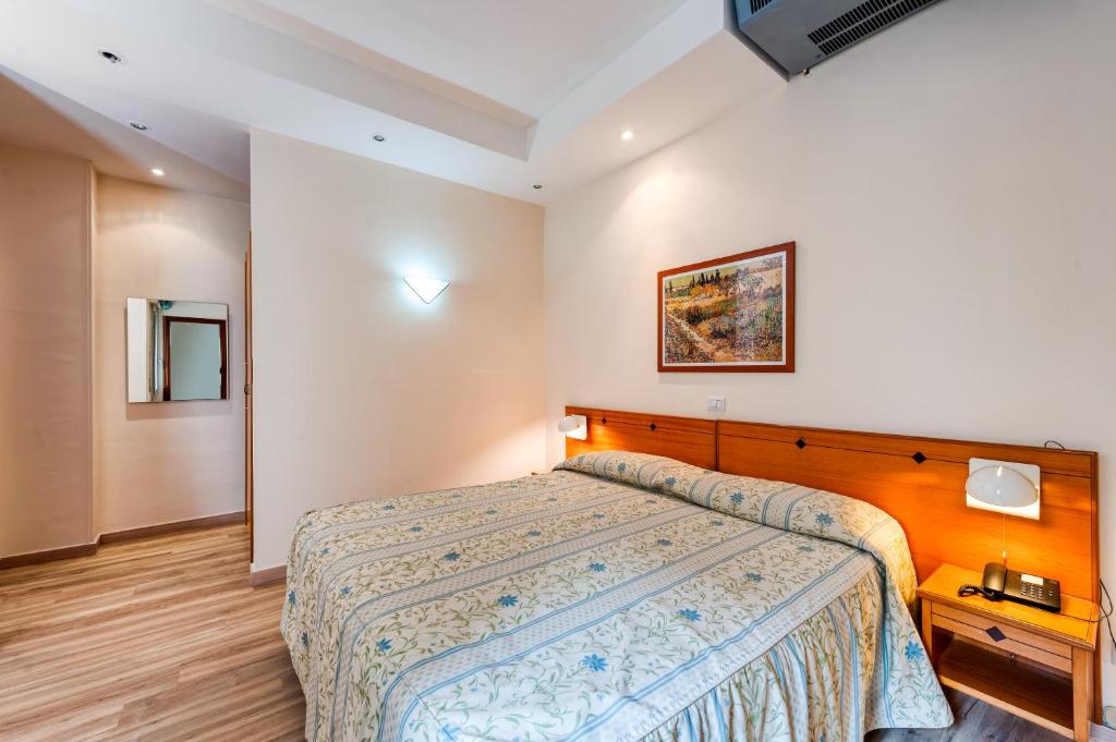 Postel nebo postele na pokoji v ubytování Hotel Barsotti