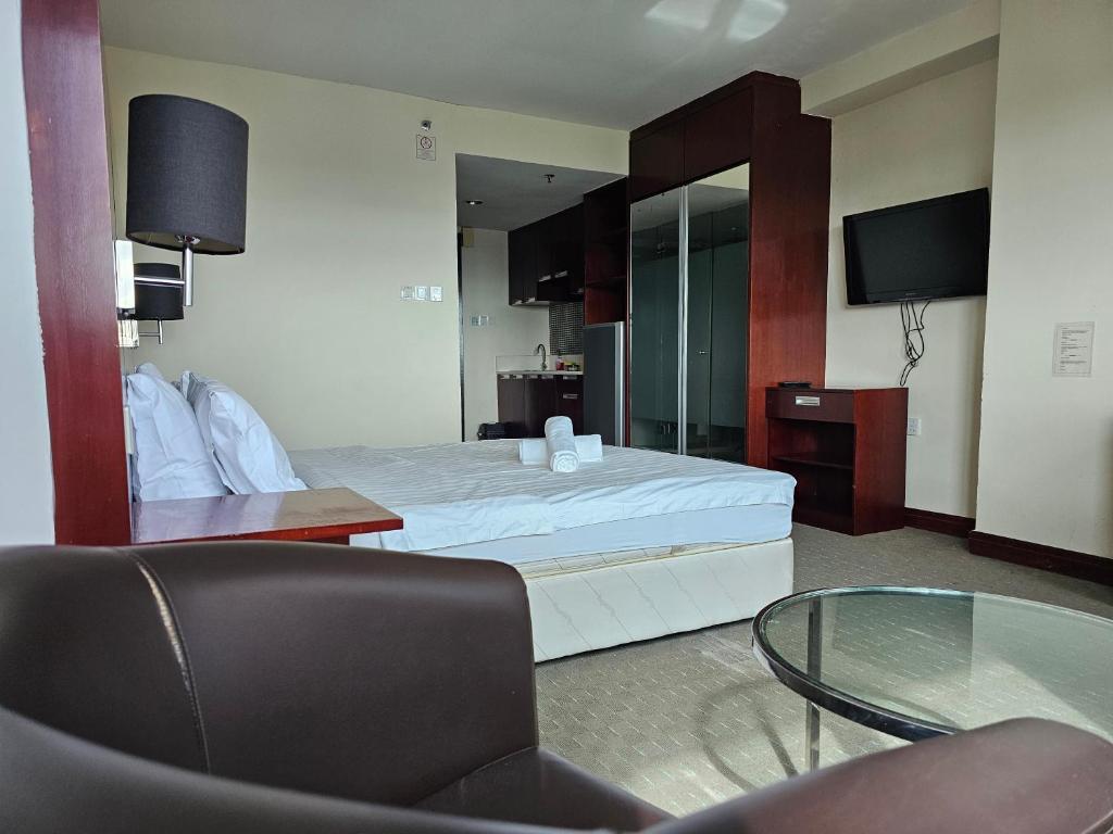 Postel nebo postele na pokoji v ubytování Kota Kinabalu City Ensuite at SCSP Ming Garden