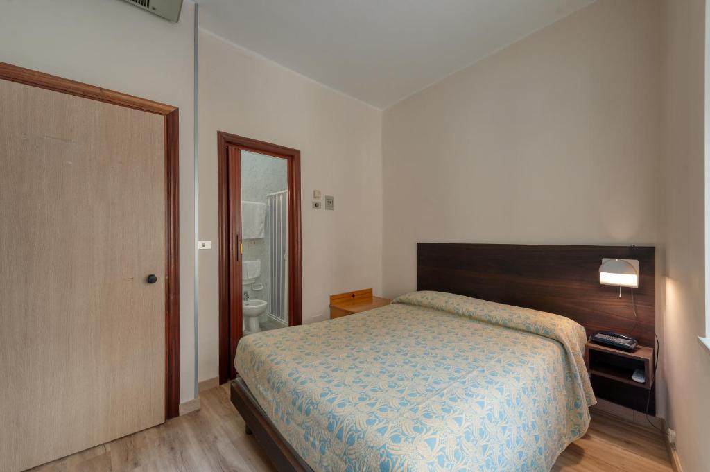 Postel nebo postele na pokoji v ubytování Hotel Barsotti