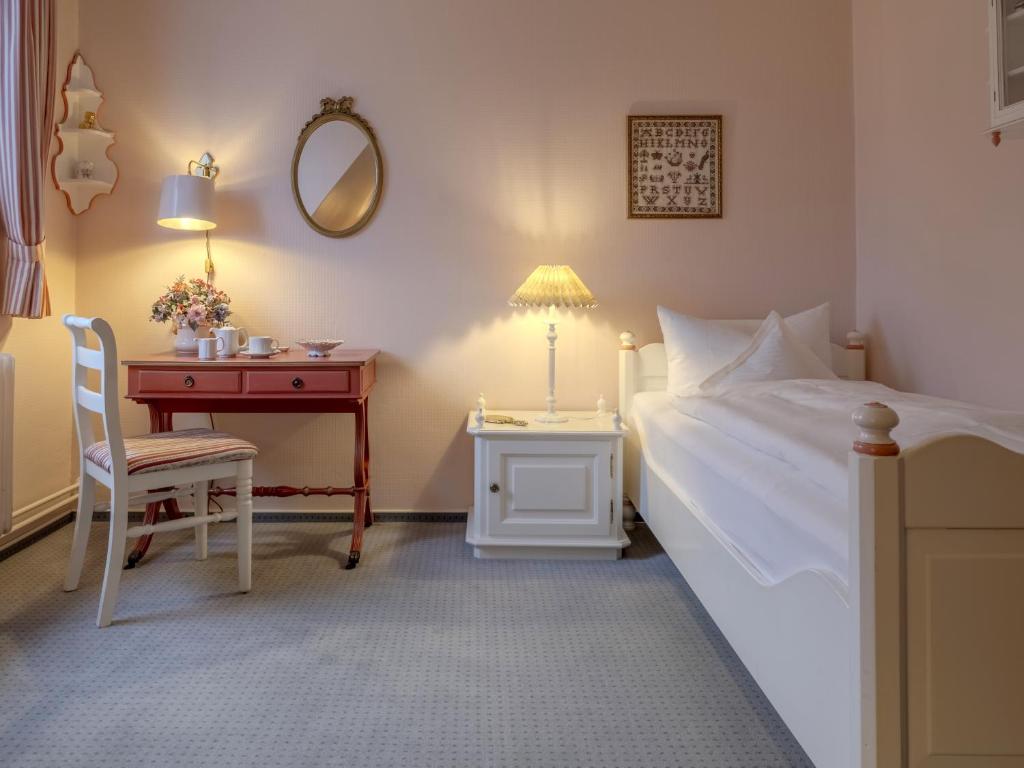 Postel nebo postele na pokoji v ubytování Hotel Wiesbaden