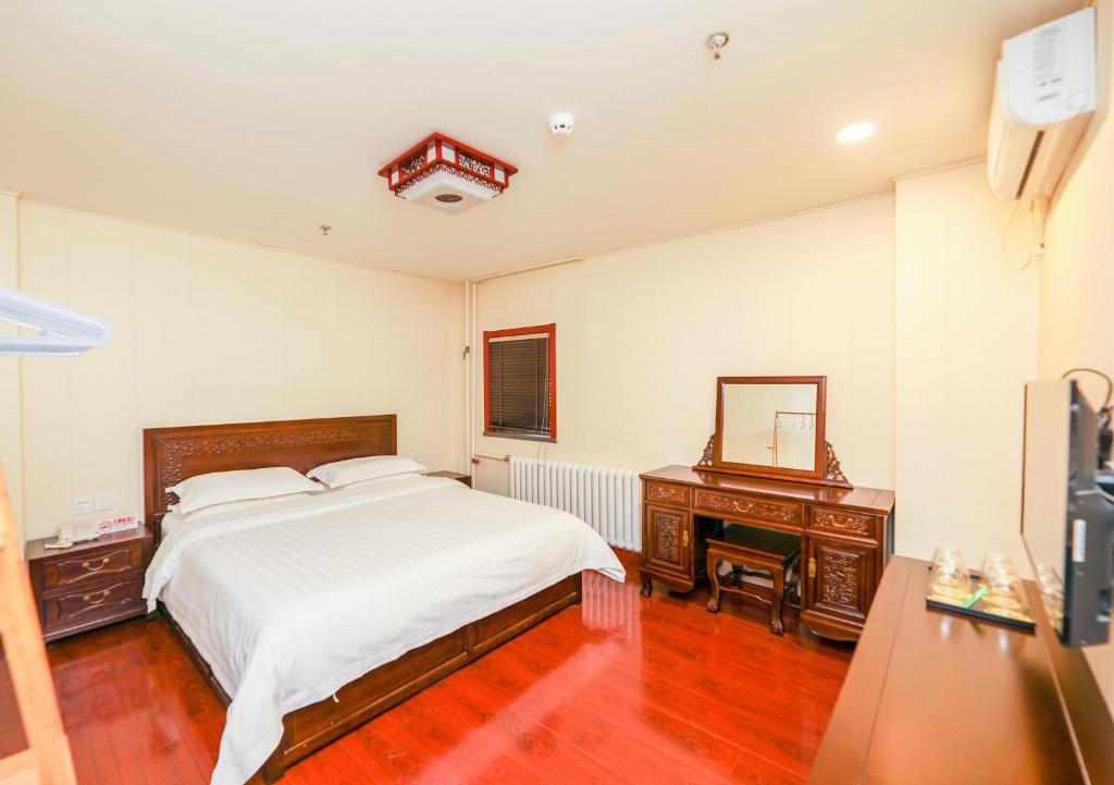 Postel nebo postele na pokoji v ubytování Yiju Hotel Beijing South Railway Station Muxiyuan Branch