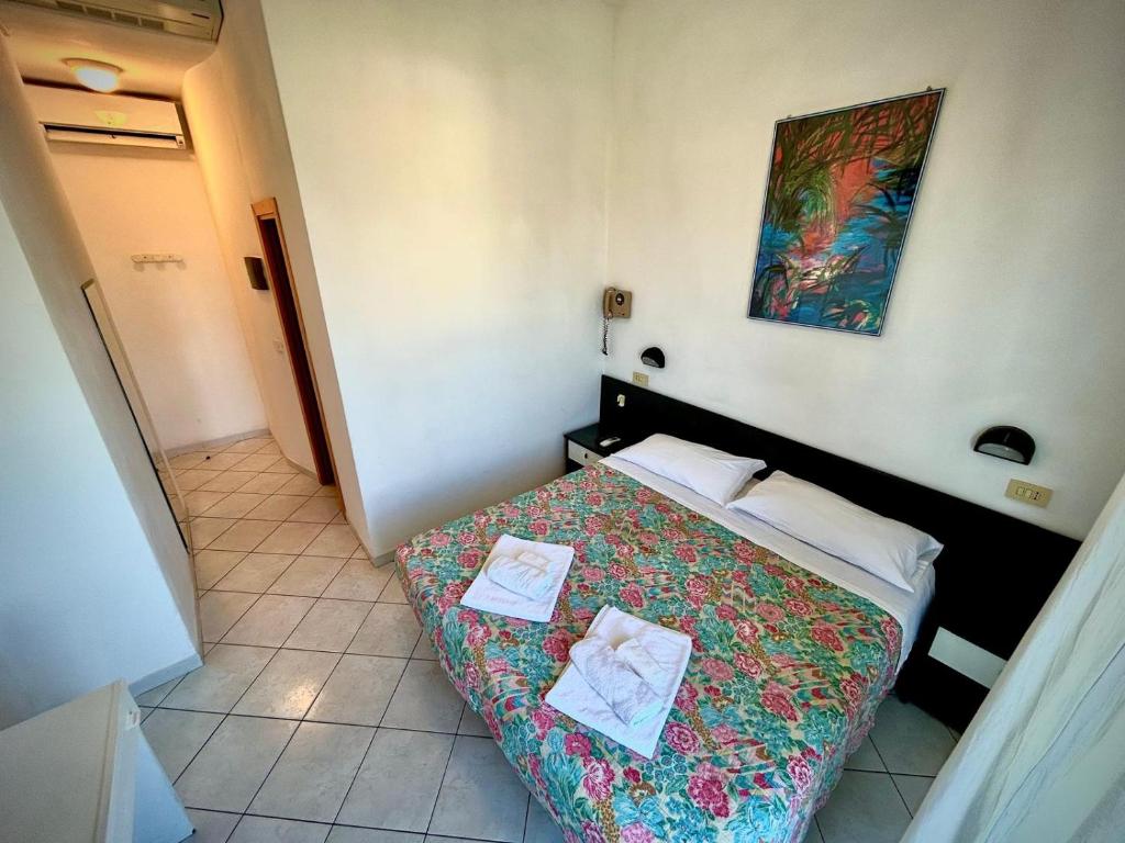 Postel nebo postele na pokoji v ubytování Hotel Sacramora