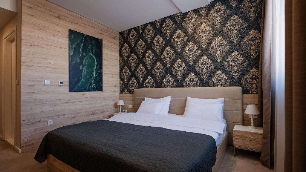 Postel nebo postele na pokoji v ubytování IG Hotel