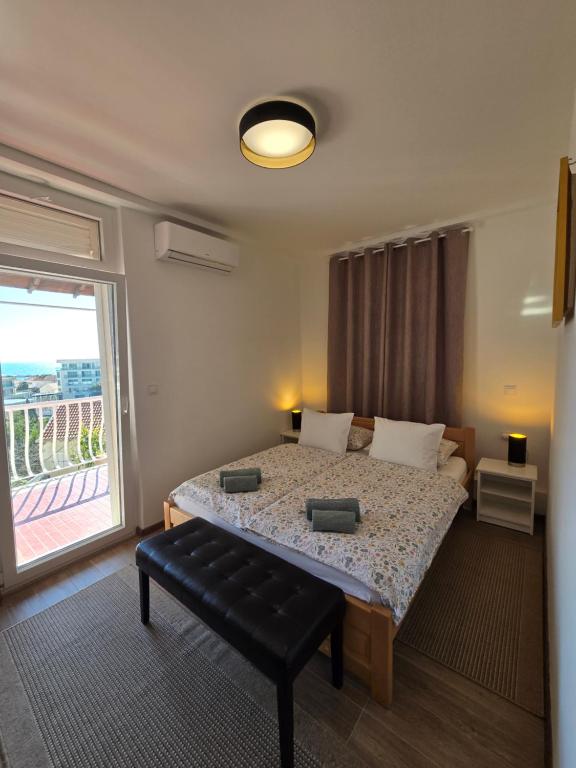 Posteľ alebo postele v izbe v ubytovaní Ivana central apartment