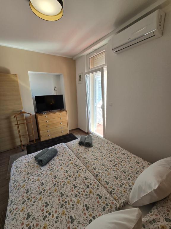 Posteľ alebo postele v izbe v ubytovaní Ivana central apartment