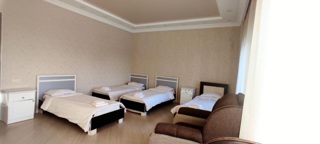Postel nebo postele na pokoji v ubytování Olympic Gyumri