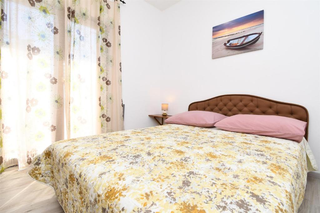 Posteľ alebo postele v izbe v ubytovaní Apartment Biserka