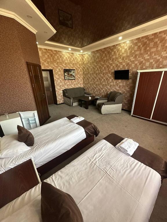 Postel nebo postele na pokoji v ubytování Olympic Gyumri