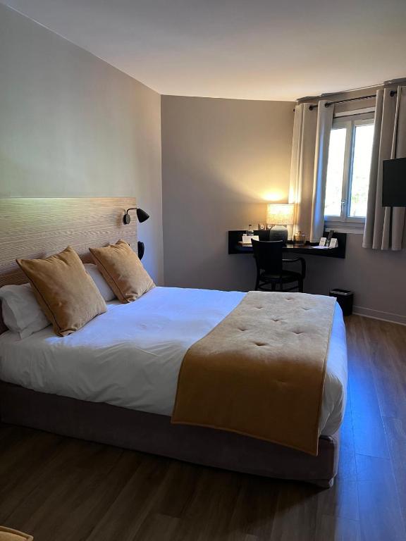 Postel nebo postele na pokoji v ubytování Hôtel-Restaurant de l'Embarcadère