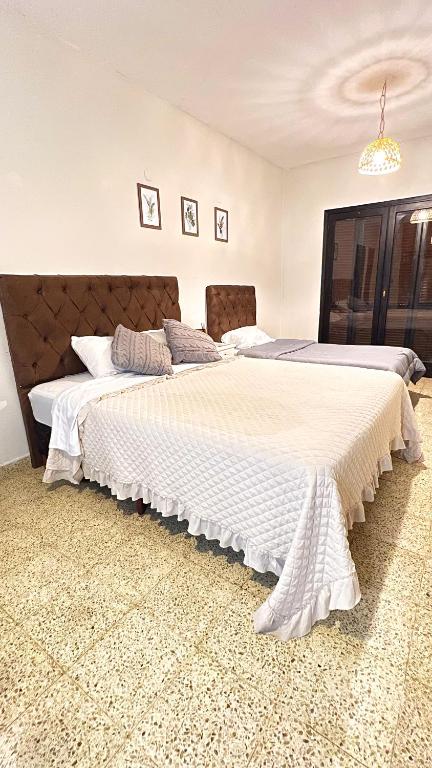 Postel nebo postele na pokoji v ubytování Hotel Herrera