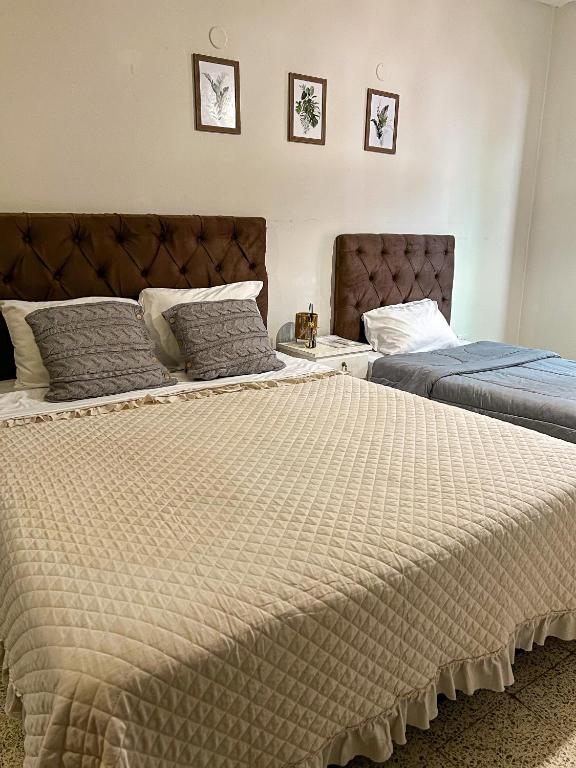 Postel nebo postele na pokoji v ubytování Hotel Herrera