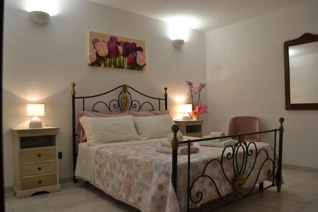 Postel nebo postele na pokoji v ubytování TAVERNETTA DEL BORGO