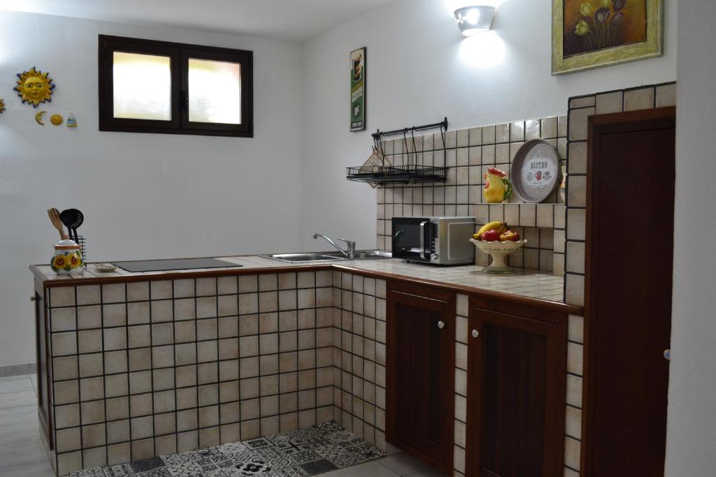 Kuchyň nebo kuchyňský kout v ubytování TAVERNETTA DEL BORGO