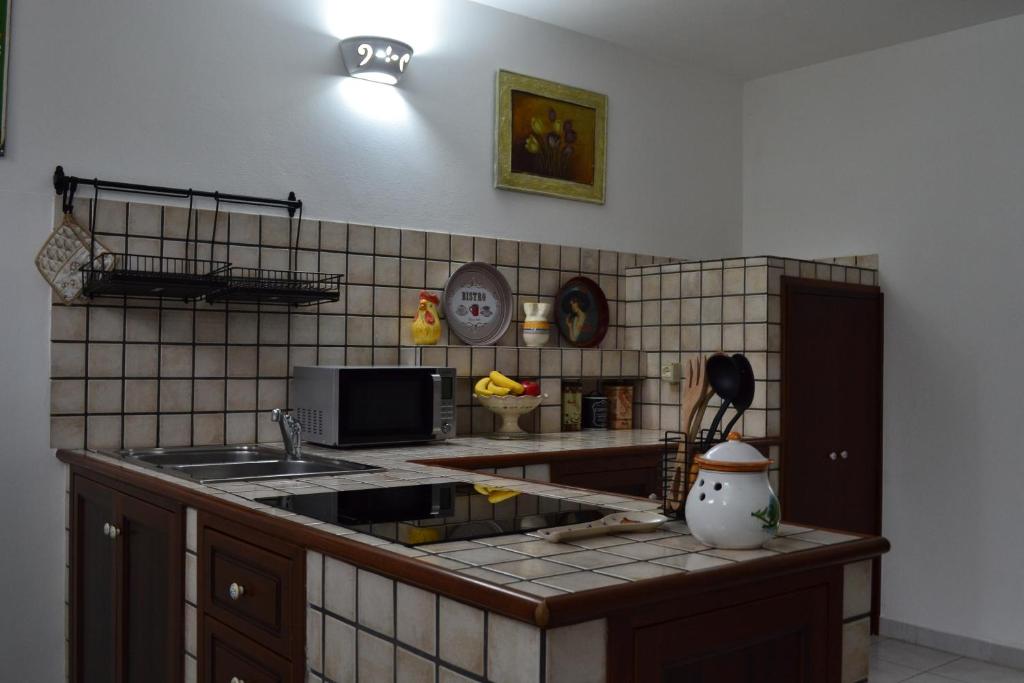 Kuchyň nebo kuchyňský kout v ubytování TAVERNETTA DEL BORGO