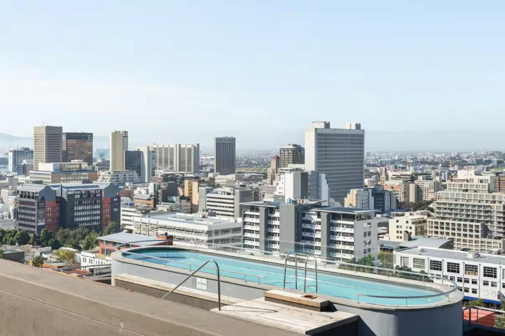 a view of a city with a swimming pool at Central Apartment in Cape Town in Cape Town