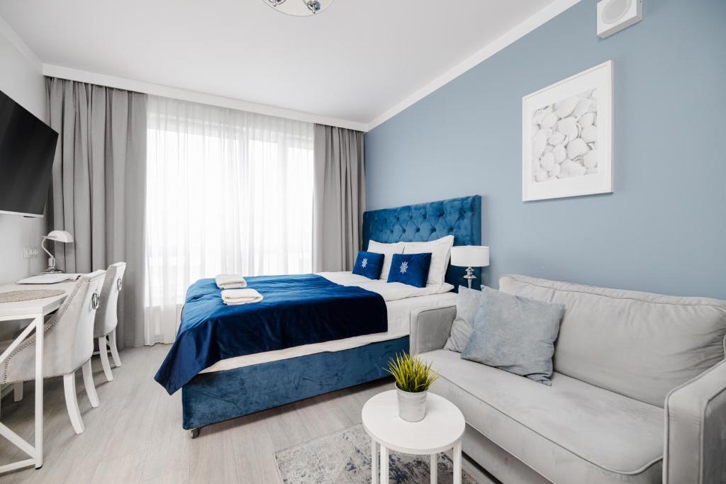 Postel nebo postele na pokoji v ubytování INA Rent - Śląska 12