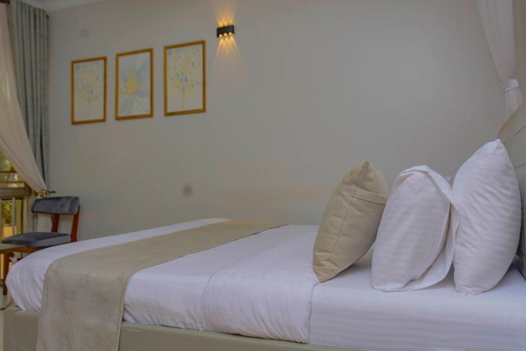 Postel nebo postele na pokoji v ubytování NIBA Hotel