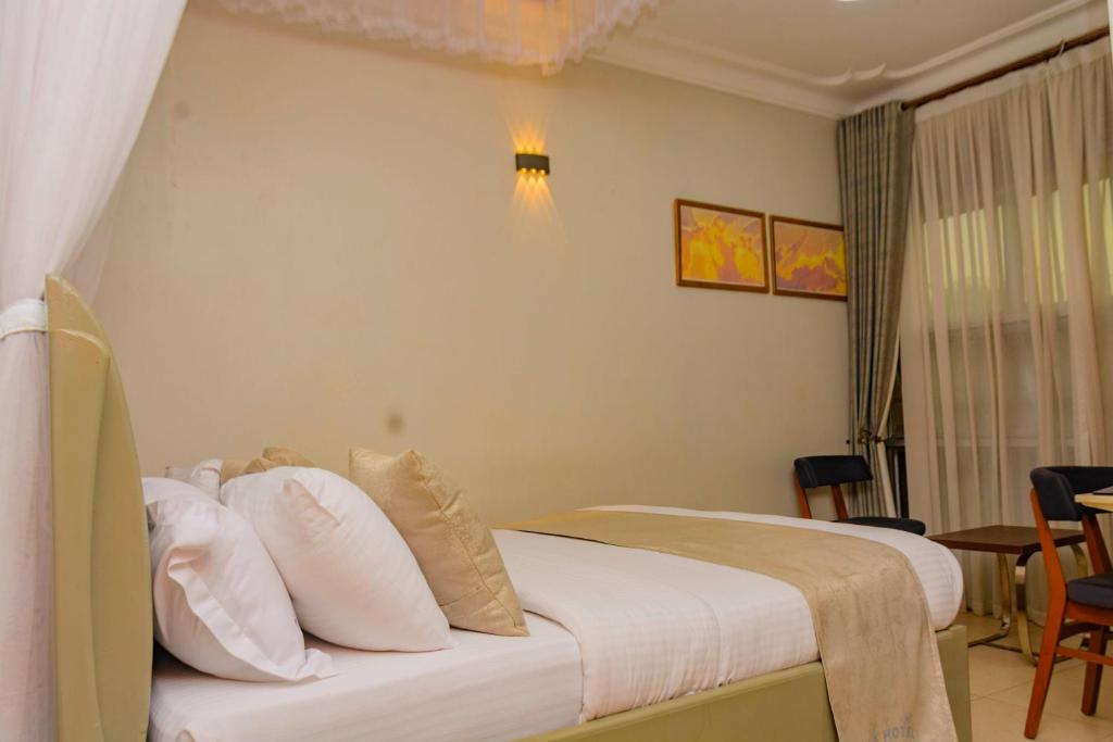 Postel nebo postele na pokoji v ubytování NIBA Hotel
