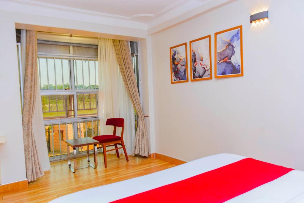 Postel nebo postele na pokoji v ubytování NIBA Hotel