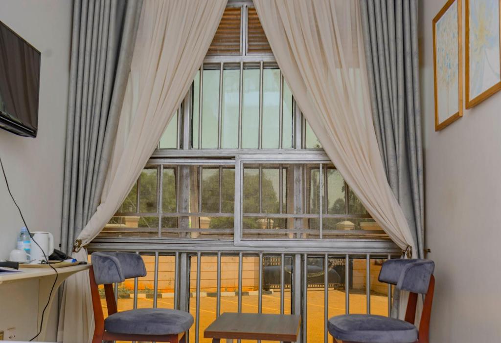 TV a/nebo společenská místnost v ubytování NIBA Hotel