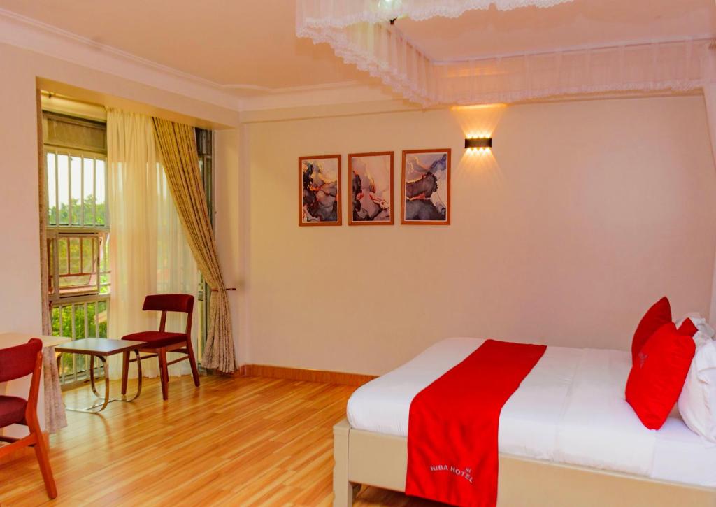 Postel nebo postele na pokoji v ubytování NIBA Hotel