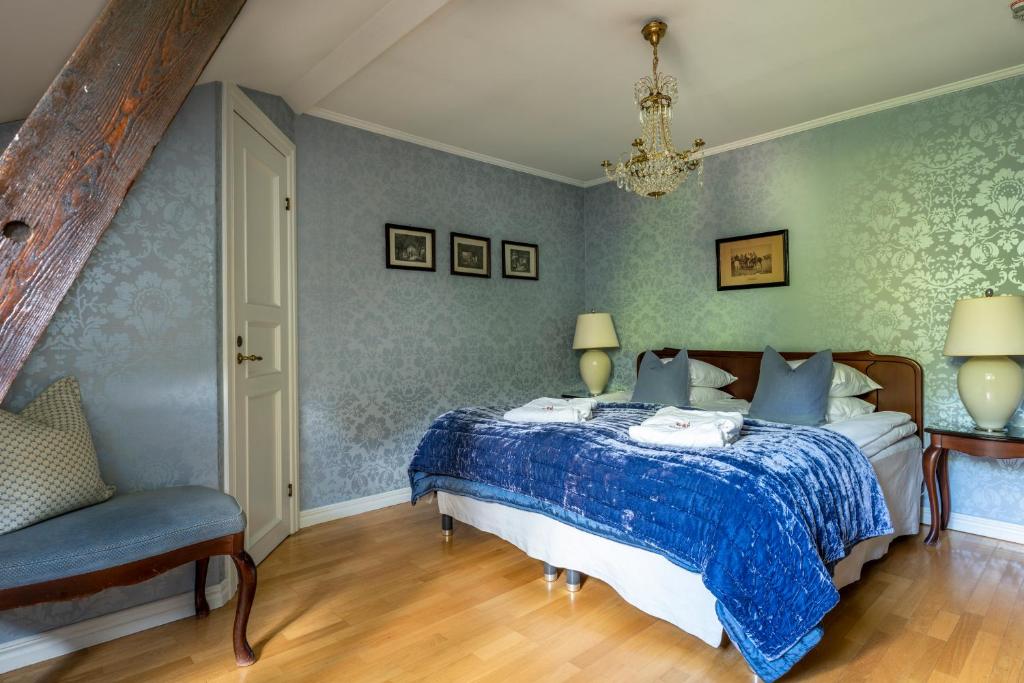 Postel nebo postele na pokoji v ubytování Thorskogs Slott