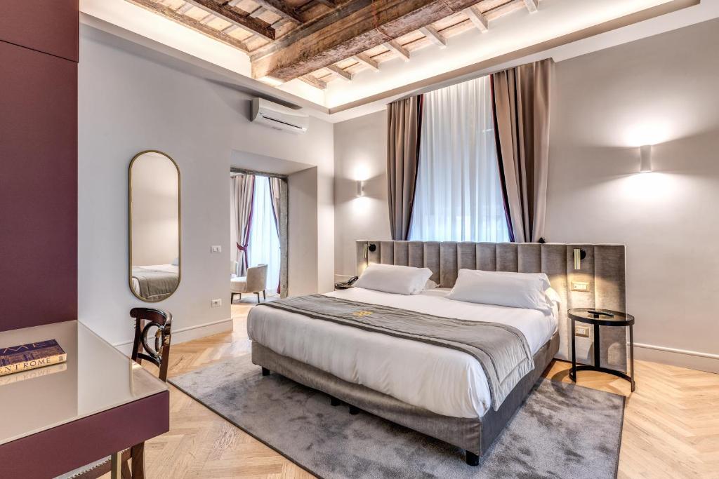 Postel nebo postele na pokoji v ubytování Eitch Borromini Palazzo Pamphilj