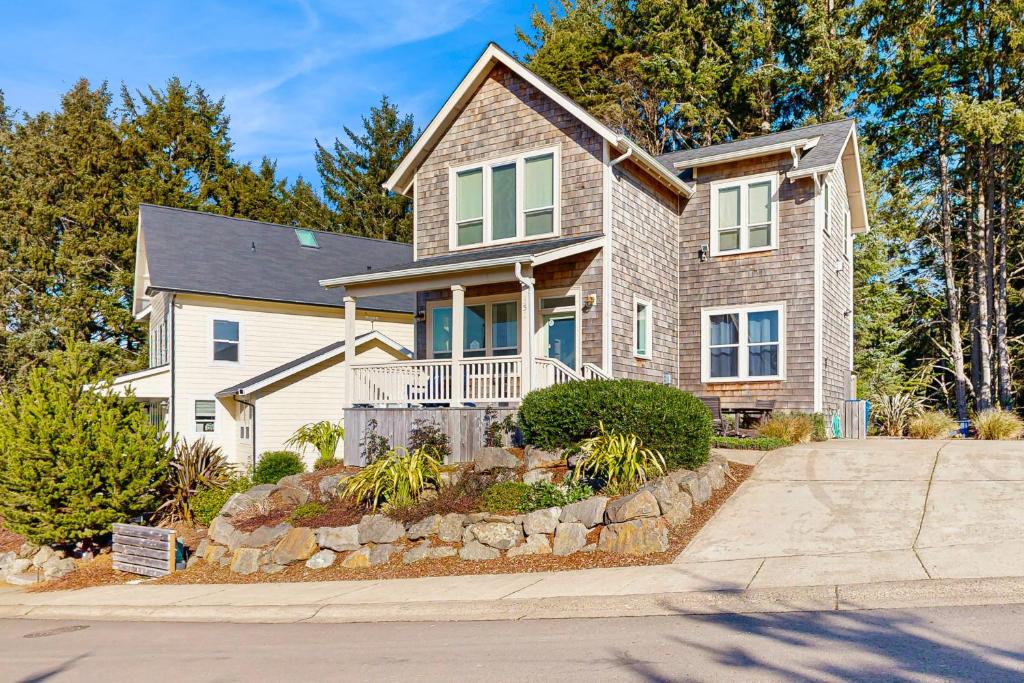 a house with a stone driveway in front of it at The Turtle Nest in Lincoln City