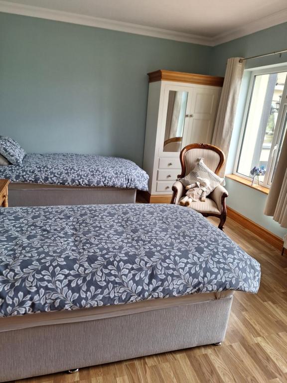 Postel nebo postele na pokoji v ubytování Ballnamona house