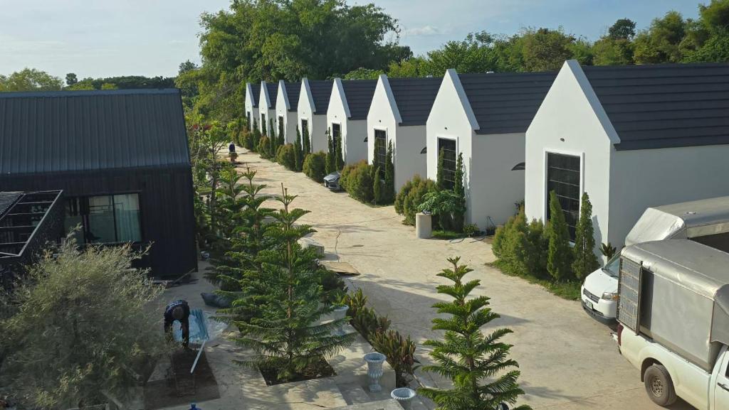 an aerial view of a house with trees in a driveway at เลอร์กบินทร์ in Kabin Buri