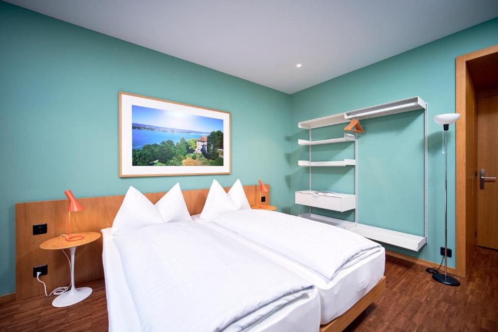 Postel nebo postele na pokoji v ubytování Hotel Arenenberg