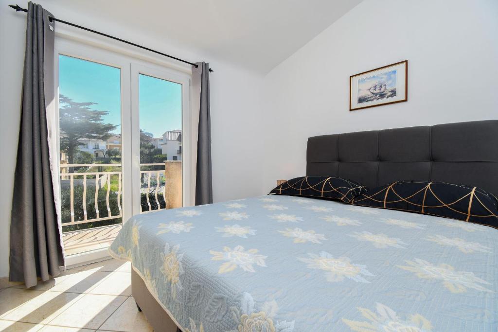 Posteľ alebo postele v izbe v ubytovaní Apartment Biserka