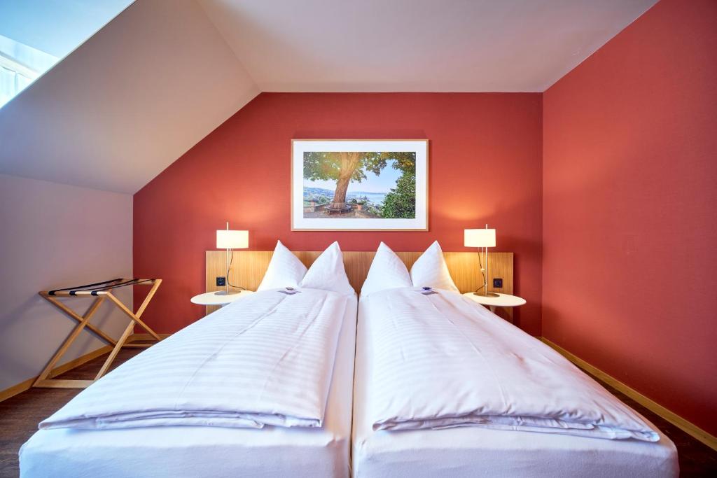 Postel nebo postele na pokoji v ubytování Hotel Arenenberg