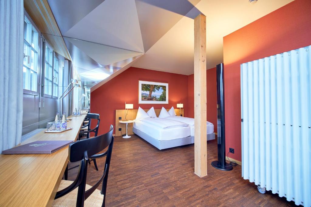 Postel nebo postele na pokoji v ubytování Hotel Arenenberg