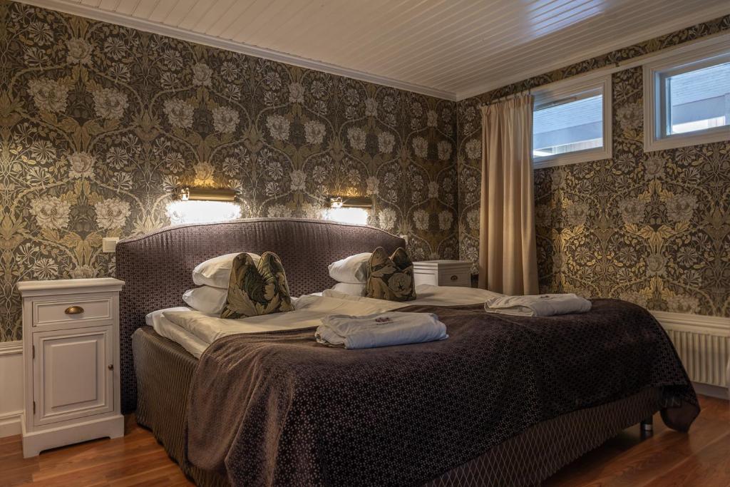 Postel nebo postele na pokoji v ubytování Thorskogs Slott