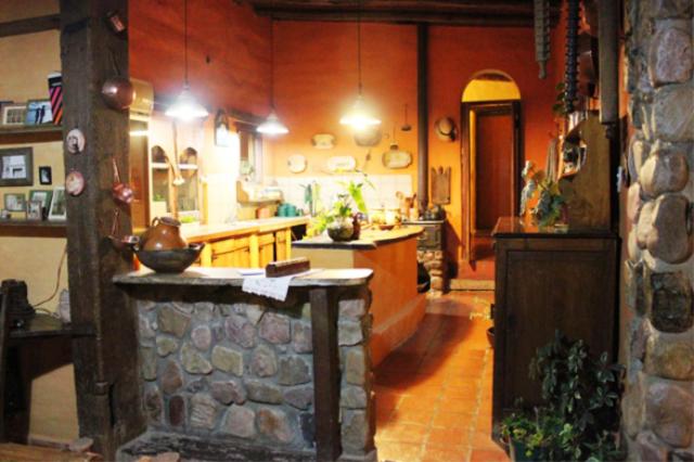 a kitchen with a stone counter in a room at Rincon del Valle in San Salvador de Jujuy