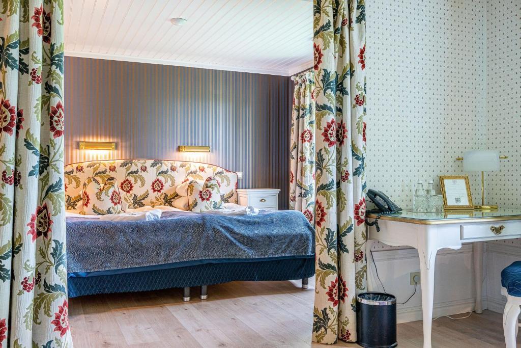 Postel nebo postele na pokoji v ubytování Thorskogs Slott