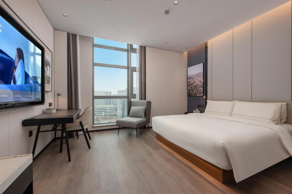 Postel nebo postele na pokoji v ubytování Atour Hotel Zhuhai North Station Midea Baolong City