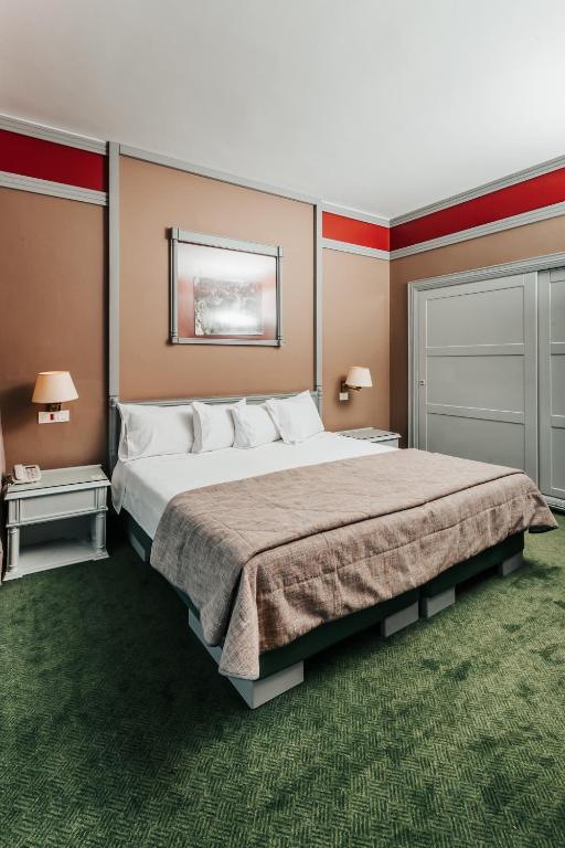 Postel nebo postele na pokoji v ubytování Printania Palace Hotel