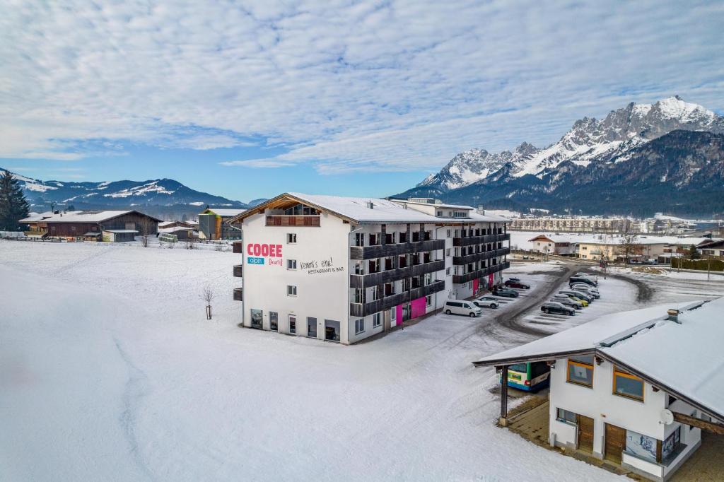an aerial view of a hotel in the snow at COOEE alpin Hotel Kitzbüheler Alpen in Sankt Johann in Tirol