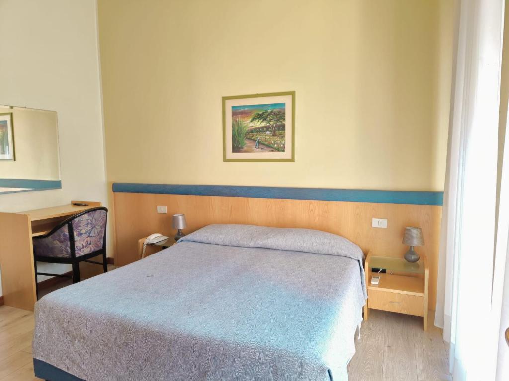 Postel nebo postele na pokoji v ubytování Hotel Montepiana